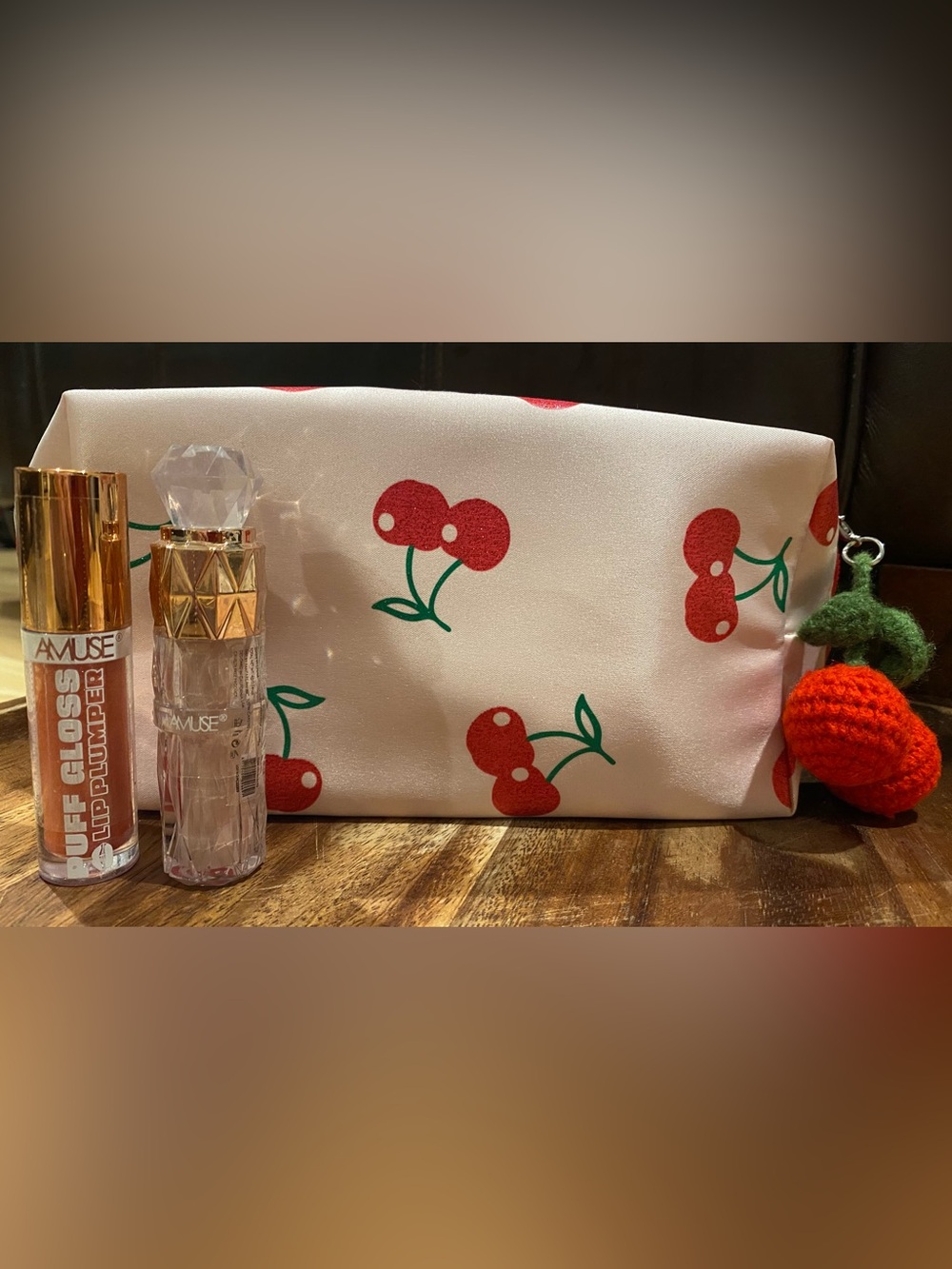 Satin like Cherry Print Makeup Bag and 2 Amuse lip gloss & lip plumping tubes.